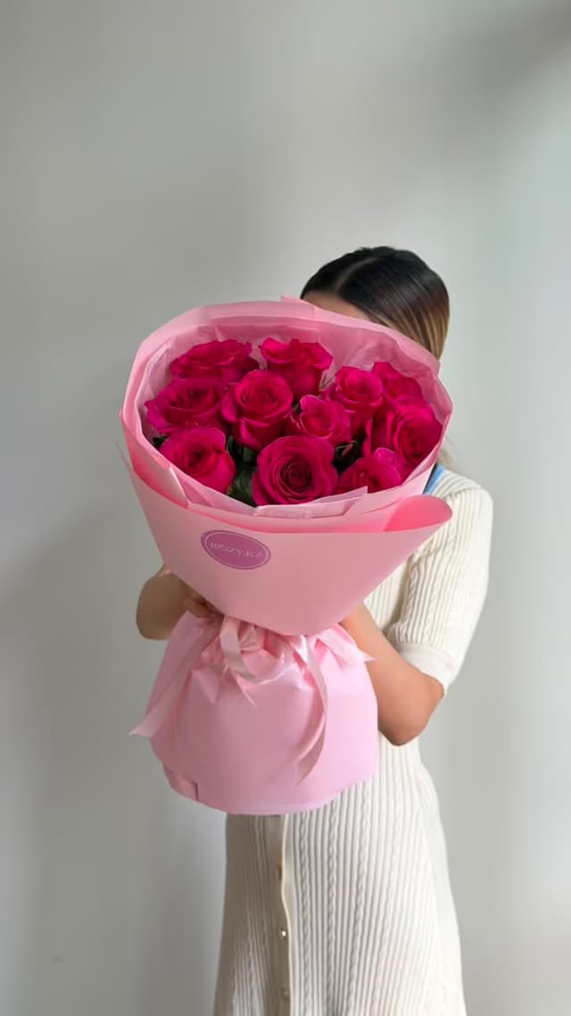 11 bright pink roses